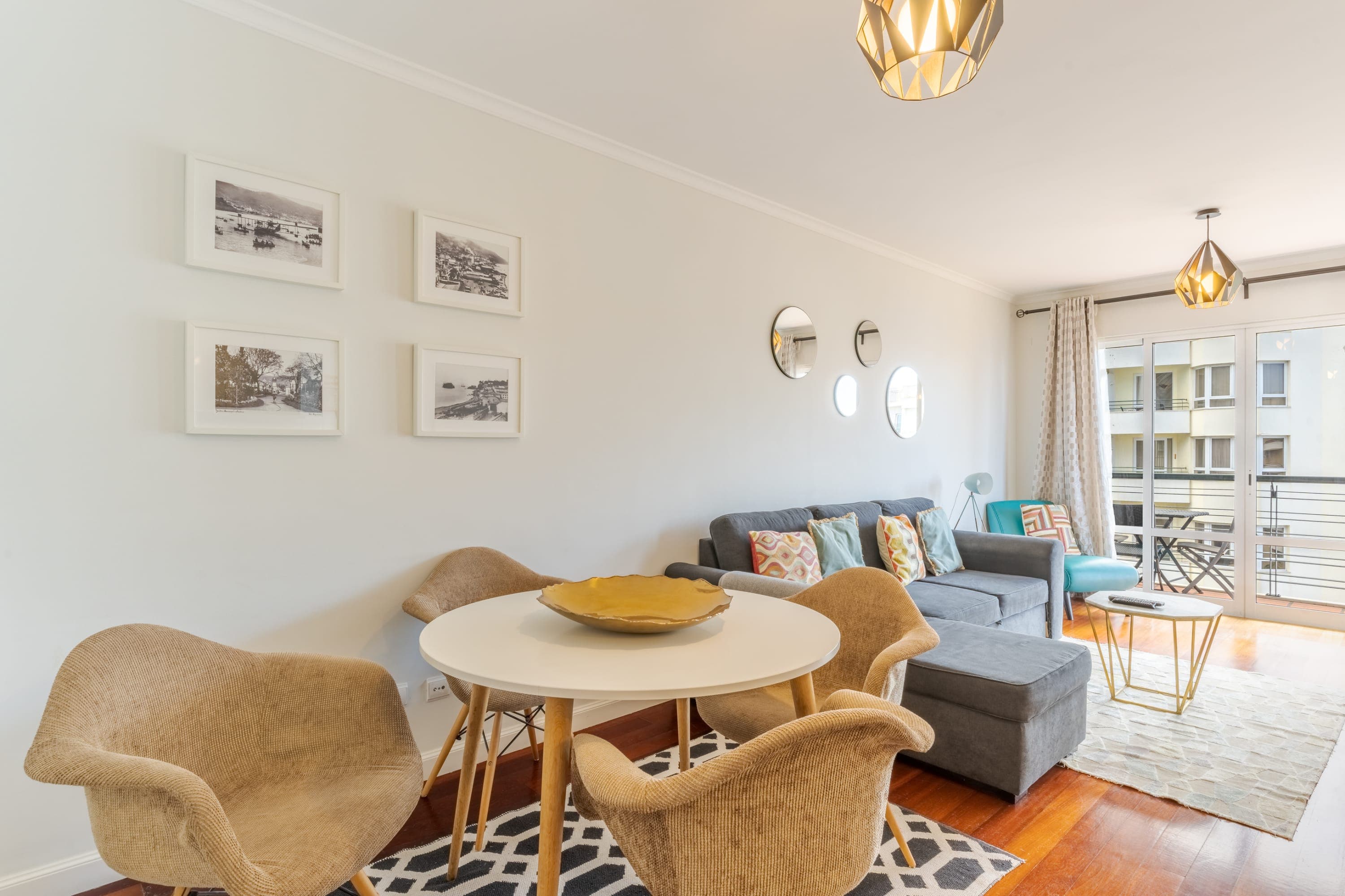 Open-plan dining and living area with sea-view window