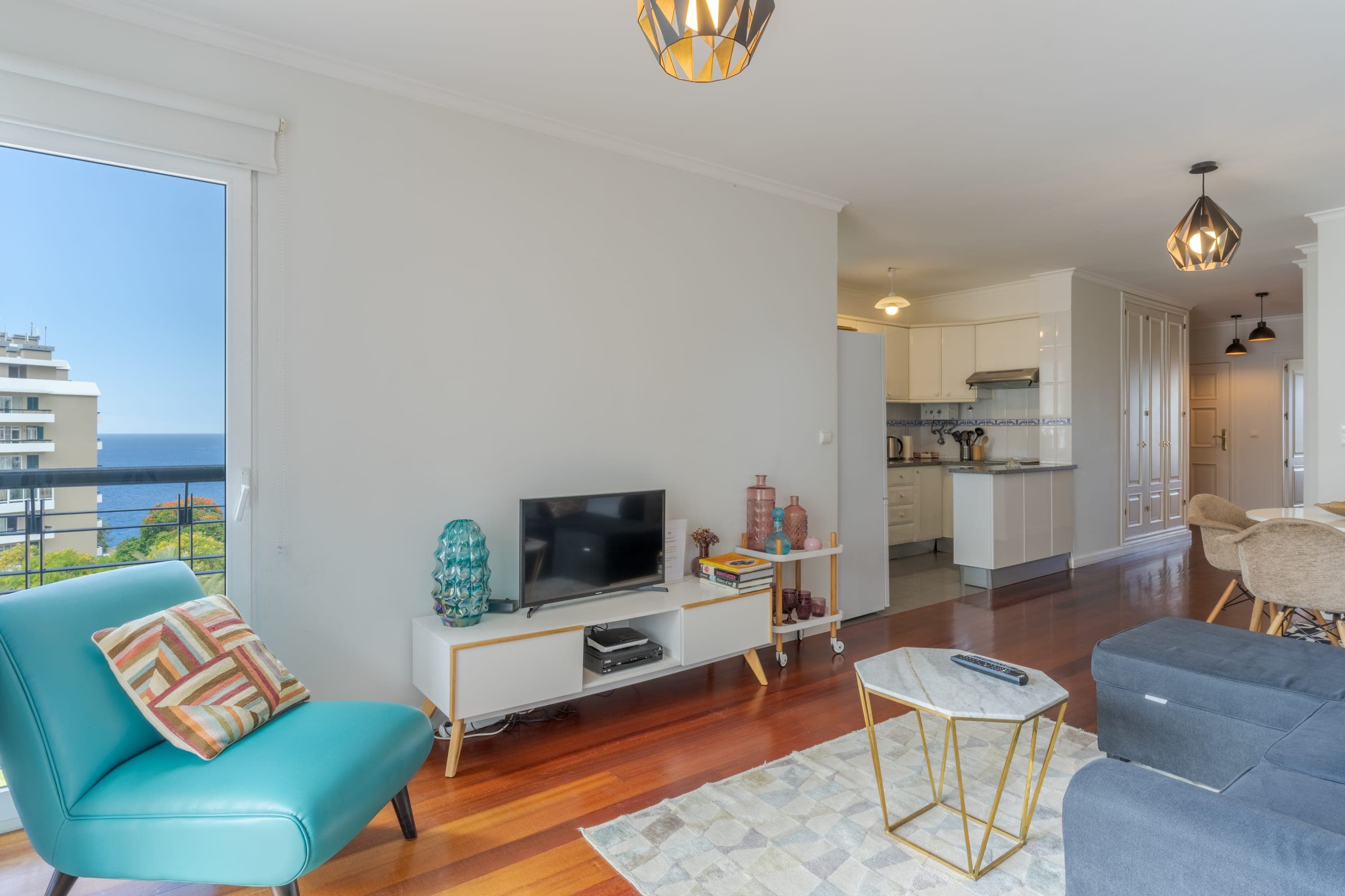 Living room with sea-view window and TV unit