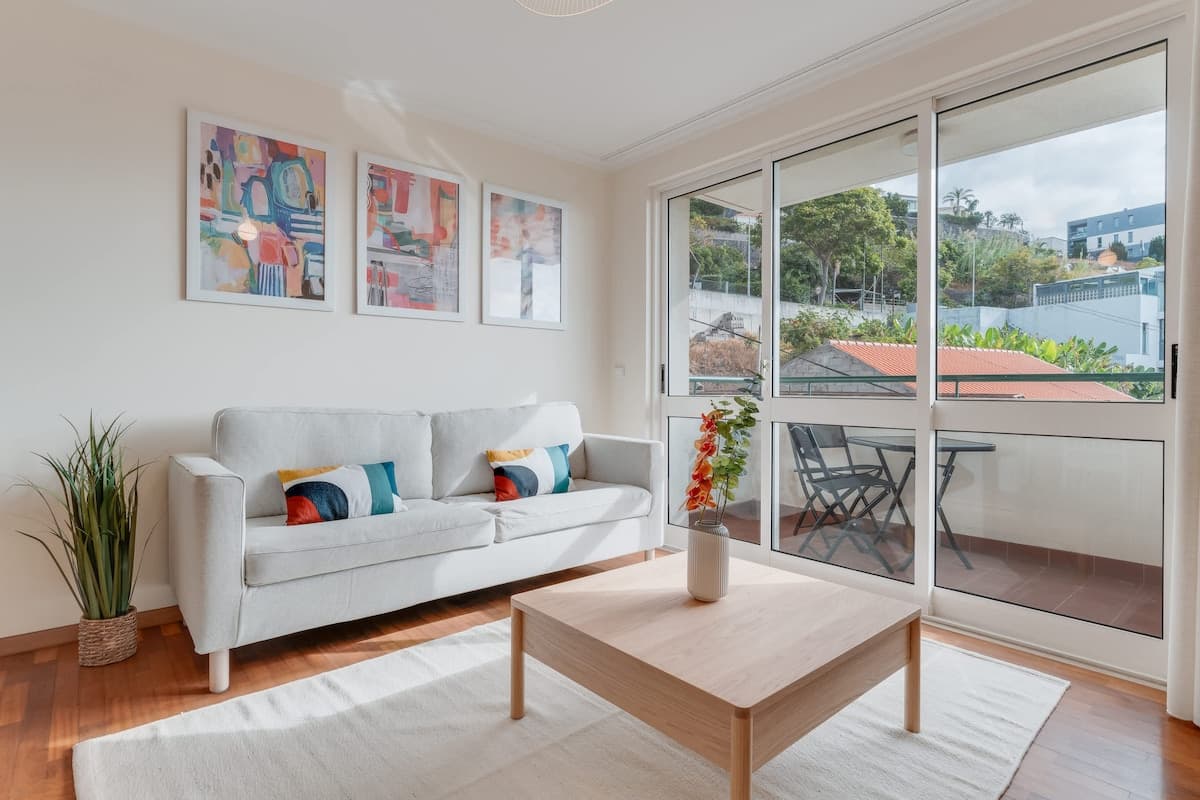 Living room with television and access to the balcony