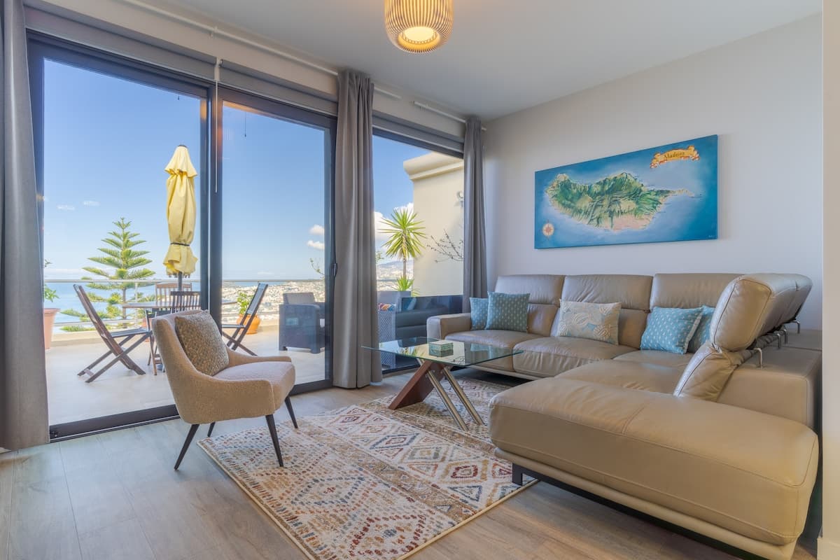 Living area with a modern sofa and chaise, perfect for relaxing