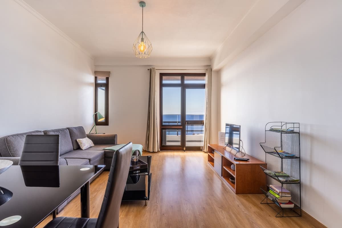 Sala de estar com sofá-cama