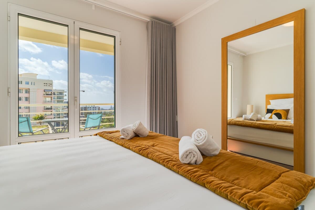 Queen Size bed with a private balcony