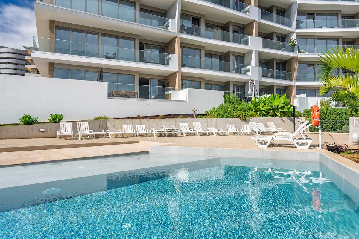 Tranquil adults-only pool surrounded by a peaceful setting — ideal for relaxing, sunbathing, and enjoying quiet moments under the Madeira sun.