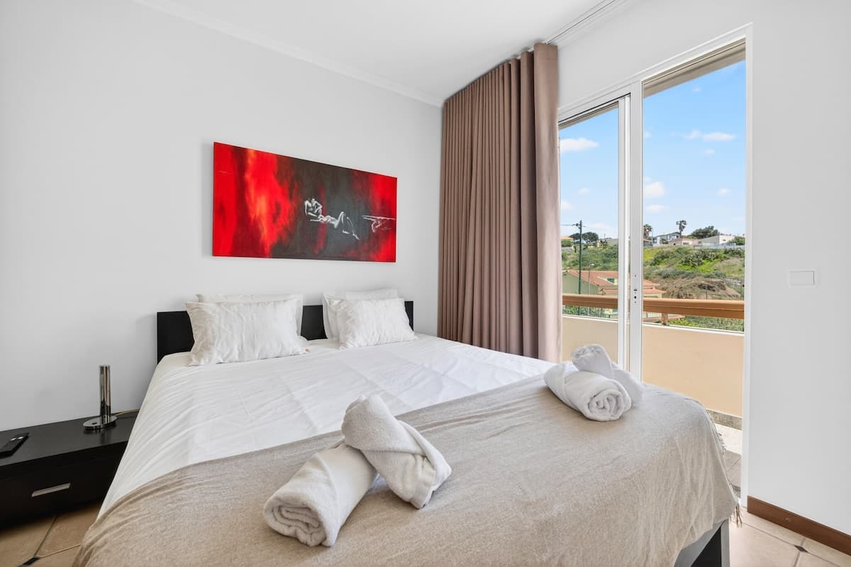 Welcoming main bedroom with double bed, fresh linens, and ensuite bathroom.